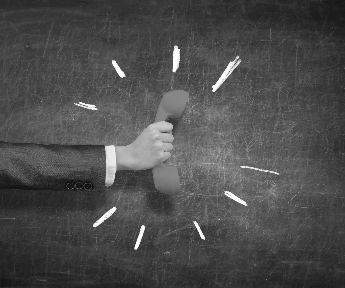 Hand holding a telephone receiver, representing a clear call to action that encourages customers to contact a business and take the next step.
