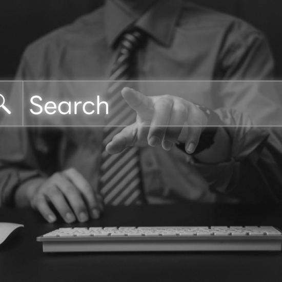 Business owner using an online search bar to find services, representing businesses trying to improve search visibility and show up when people search online.